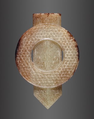 Lot 1769 - AN ARCHAISTIC PALE YELLOW AND RUSSET JADE DISC AND BLADE, GUIBI, QING