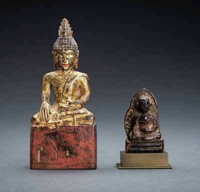 Lot 1016 - A LOT WITH TWO LACQUERED MINIATURE WOOD FIGURES OF A BUDHHA