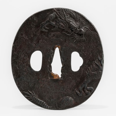 Lot 1574 - AN UNUSUAL LARGE IRON TSUBA WITH A DRAGON