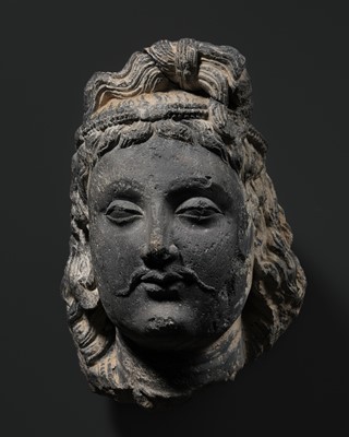 Lot 612 - A SCHIST HEAD OF MAITREYA, ANCIENT REGION OF GANDHARA, 2ND -3RD CENTURY