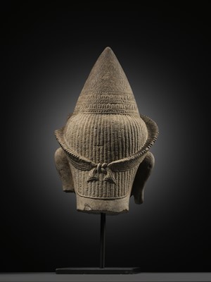 Lot 259 - A SANDSTONE HEAD OF A MALE DIVINITY, ANGKOR WAT STYLE, 12TH CENTURY