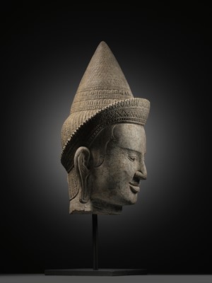 Lot 259 - A SANDSTONE HEAD OF A MALE DIVINITY, ANGKOR WAT STYLE, 12TH CENTURY