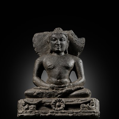 Lot 334 - A BLACK STONE STELE DEPICTING AN ENTHRONED MAHAVIRA ATTENDED BY A YAKSHA AND YAKSHI, PALA PERIOD, 11TH-12TH CENTURY