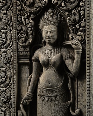 Lot 267 - A LARGE SANDSTONE RELIEF OF AN APSARA, BAYON STYLE, ANGKOR PERIOD, LATE 12TH-13TH CENTURY