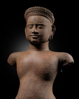 Lot 400 - A RED SANDSTONE FIGURE OF SHIVA, ANGKOR PERIOD, BANTEAY SREI STYLE