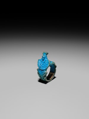 Lot 46 - A RARE TURQUOISE GLAZED FAIENCE RING WITH AEGIS OF NEPHTHYS, THIRD INTERMEDIATE PERIOD, DYNASTY XXII