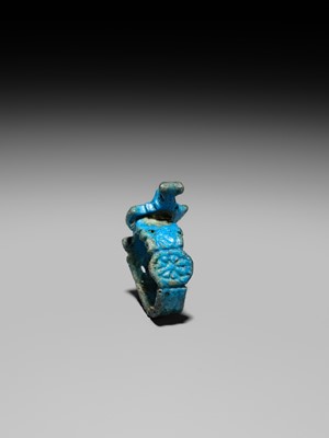 Lot 46 - A RARE TURQUOISE GLAZED FAIENCE RING WITH AEGIS OF NEPHTHYS, THIRD INTERMEDIATE PERIOD, DYNASTY XXII