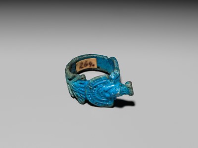 Lot 46 - A RARE TURQUOISE GLAZED FAIENCE RING WITH AEGIS OF NEPHTHYS, THIRD INTERMEDIATE PERIOD, DYNASTY XXII