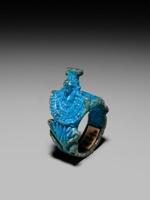 Lot 46 - A RARE TURQUOISE GLAZED FAIENCE RING WITH AEGIS OF NEPHTHYS, THIRD INTERMEDIATE PERIOD, DYNASTY XXII