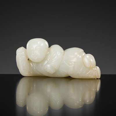 Lot 442 - A WHITE JADE ‘RECLINING BOY AND LOTUS’ BRUSH REST, YUAN TO MING DYNASTY