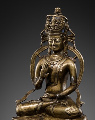 Lot 289 - A SILVER-INLAID BRONZE FIGURE OF AMOGHASIDDHI, TIBET, 13TH-14TH CENTURY