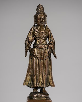 Lot 713 - A GILT-BRONZE FIGURE OF GUANYIN, TANG DYNASTY