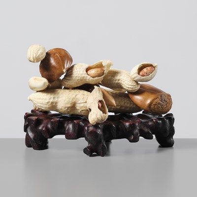 Lot 373 - A FINE STAINED IVORY ‘TROMPE-L'ŒIL’ OKIMONO OF A PILE OF PEANUTS AND CHESTNUTS