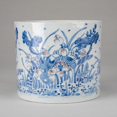 Lot 915 - AN UNDERGLAZE BLUE AND COPPER-RED PORCELAIN BRUSH POT WITH LOTUS FLOWERS, 19TH CENTURY