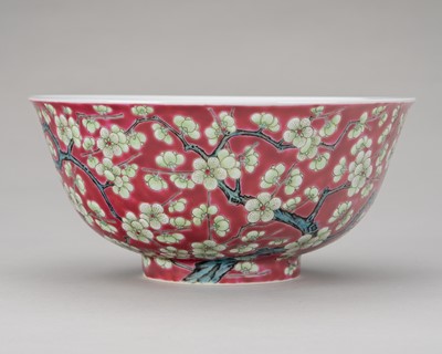 Lot 977 - A PORCELAIN RUBY-GROUND FAMILLE-ROSE 'PRUNUS' BOWL