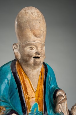 A FINE A FAHUA-GLAZED BISCUIT FIGURE OF SHOULAO, MING DYNASTY