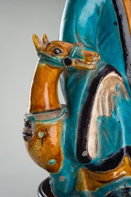 A FINE A FAHUA-GLAZED BISCUIT FIGURE OF SHOULAO, MING DYNASTY