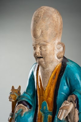 A FINE A FAHUA-GLAZED BISCUIT FIGURE OF SHOULAO, MING DYNASTY