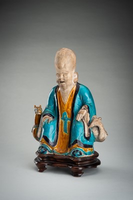 A FINE A FAHUA-GLAZED BISCUIT FIGURE OF SHOULAO, MING DYNASTY