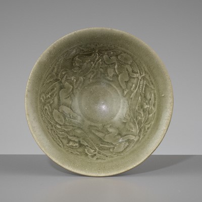 Lot 245 - A SMALL YAOZHOU CELADON-GLAZED ‘BOYS’ BOWL, NORTHERN SONG