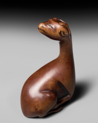 Lot 81 - A VERY RARE WOOD NETSUKE OF A SINIU
