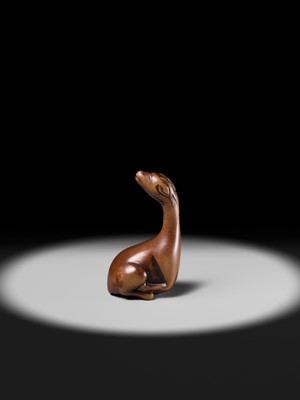 Lot 81 - A VERY RARE WOOD NETSUKE OF A SINIU