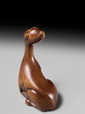 Lot 81 - A VERY RARE WOOD NETSUKE OF A SINIU