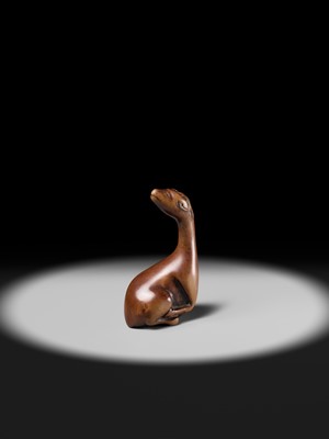 Lot 81 - A VERY RARE WOOD NETSUKE OF A SINIU