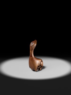 Lot 81 - A VERY RARE WOOD NETSUKE OF A SINIU