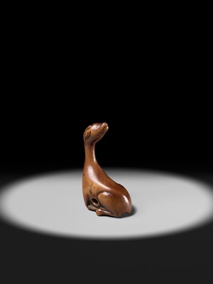 Lot 81 - A VERY RARE WOOD NETSUKE OF A SINIU