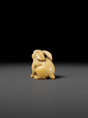 Lot 83 - YOSHIMASA: A SUBERB KYOTO SCHOOL MARINE IVORY NETSUKE OF A RABBIT