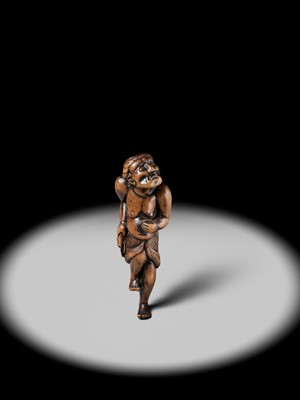 Lot 197 - A SUPERB AND LARGE EDO SCHOOL WOOD NETSUKE OF A DANCING MONEY LENDER