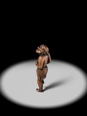 Lot 197 - A SUPERB AND LARGE EDO SCHOOL WOOD NETSUKE OF A DANCING MONEY LENDER