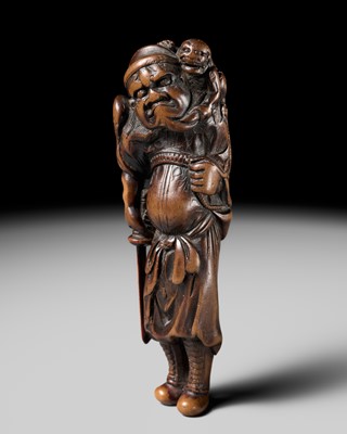 Lot 67 - A LARGE AND SUPERB WOOD NETSUKE OF SHOKI AND ONI, MITATE OF SARUMAWASHI