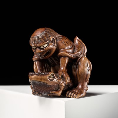 Lot 109 - MASAKAZU: A SUPERB WOOD NETSUKE OF GAMA SENNIN WITH TOAD