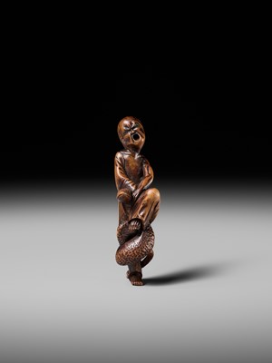 Lot 203 - KEISAI: A RARE EDO SCHOOL WOOD NETSUKE OF AN AGONISED MONK BATTLING A SNAKE