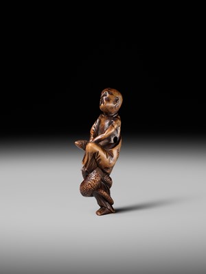 Lot 203 - KEISAI: A RARE EDO SCHOOL WOOD NETSUKE OF AN AGONISED MONK BATTLING A SNAKE