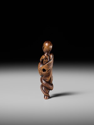 Lot 203 - KEISAI: A RARE EDO SCHOOL WOOD NETSUKE OF AN AGONISED MONK BATTLING A SNAKE