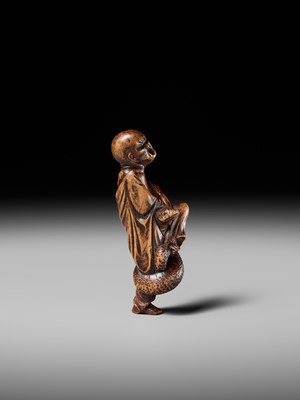 Lot 203 - KEISAI: A RARE EDO SCHOOL WOOD NETSUKE OF AN AGONISED MONK BATTLING A SNAKE