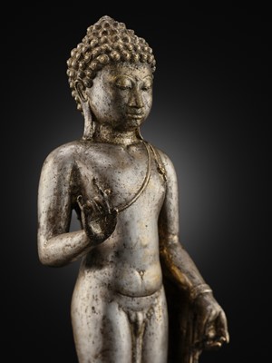 Lot 220 - A LARGE SILVER AND COPPER-ALLOY FIGURE OF BUDDHA SHAKYAMUNI, CENTRAL JAVA, CIRCA 9TH CENTURY