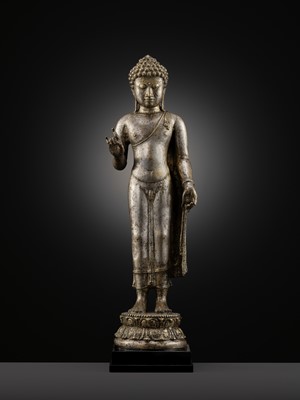 Lot 220 - A LARGE SILVER AND COPPER-ALLOY FIGURE OF BUDDHA SHAKYAMUNI, CENTRAL JAVA, CIRCA 9TH CENTURY
