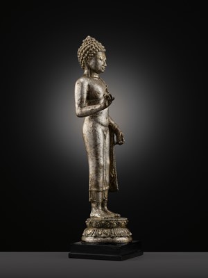 Lot 220 - A LARGE SILVER AND COPPER-ALLOY FIGURE OF BUDDHA SHAKYAMUNI, CENTRAL JAVA, CIRCA 9TH CENTURY