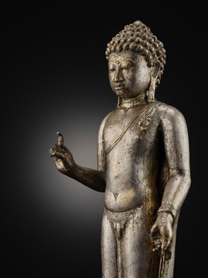 Lot 220 - A LARGE SILVER AND COPPER-ALLOY FIGURE OF BUDDHA SHAKYAMUNI, CENTRAL JAVA, CIRCA 9TH CENTURY