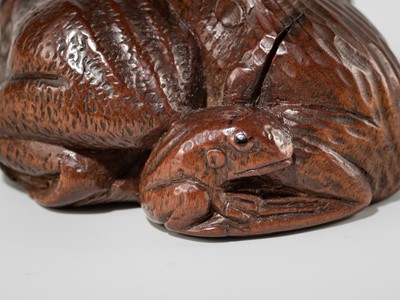 Lot 381 - SENKO: A WOOD NETSUKE OF FROGS AND LOTUS