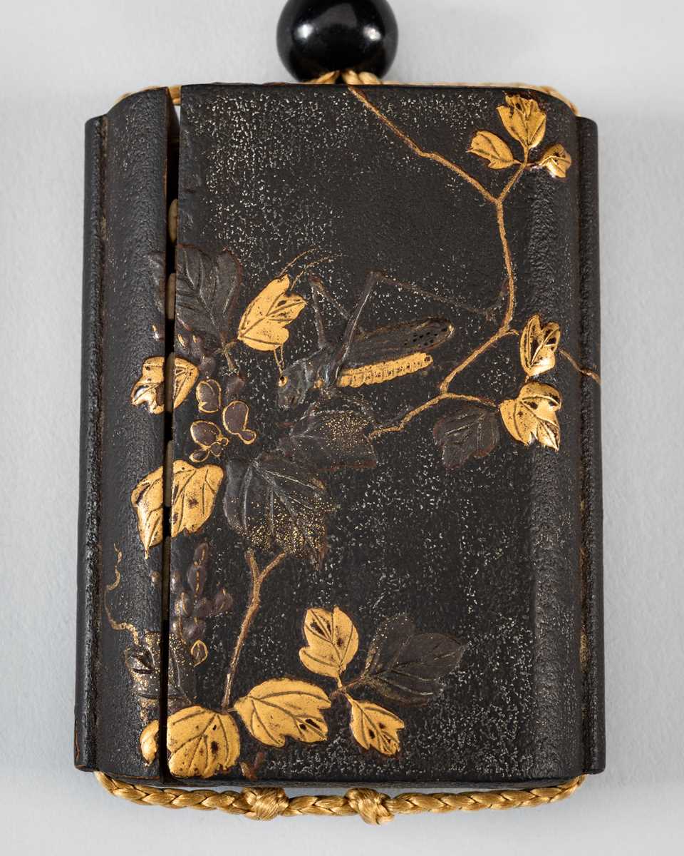 Lot 1414 - A SIDE-OPENING LACQUER INRO WITH A GRASSHOPPER ON LEAFY VINES