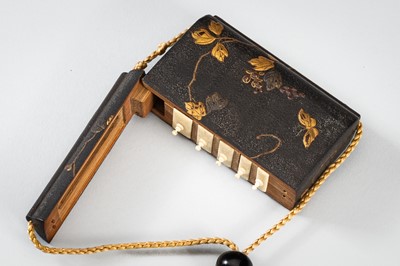 Lot 1414 - A SIDE-OPENING LACQUER INRO WITH A GRASSHOPPER ON LEAFY VINES