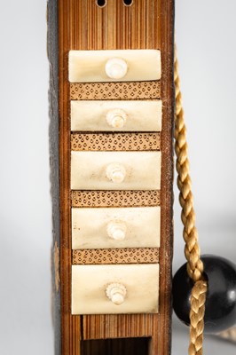 Lot 1414 - A SIDE-OPENING LACQUER INRO WITH A GRASSHOPPER ON LEAFY VINES