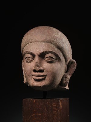 Lot 195 - A LARGE PINK SANDSTONE HEAD OF BUDDHA, MATHURA, KUSHAN PERIOD