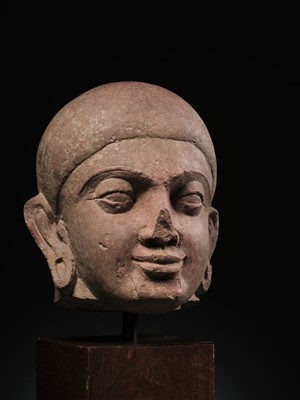 Lot 195 - A LARGE PINK SANDSTONE HEAD OF BUDDHA, MATHURA, KUSHAN PERIOD