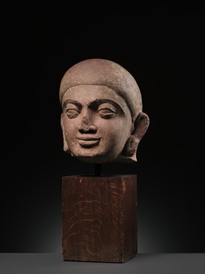 Lot 195 - A LARGE PINK SANDSTONE HEAD OF BUDDHA, MATHURA, KUSHAN PERIOD